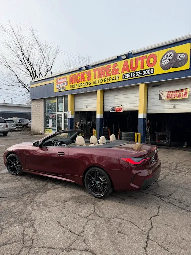 Customer cars waiting for brake service in the lot at Nick's Tire & Auto
